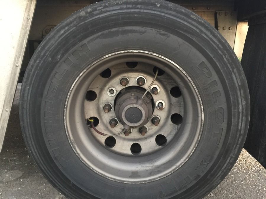 damaged truck tire with missing lugs broken stud