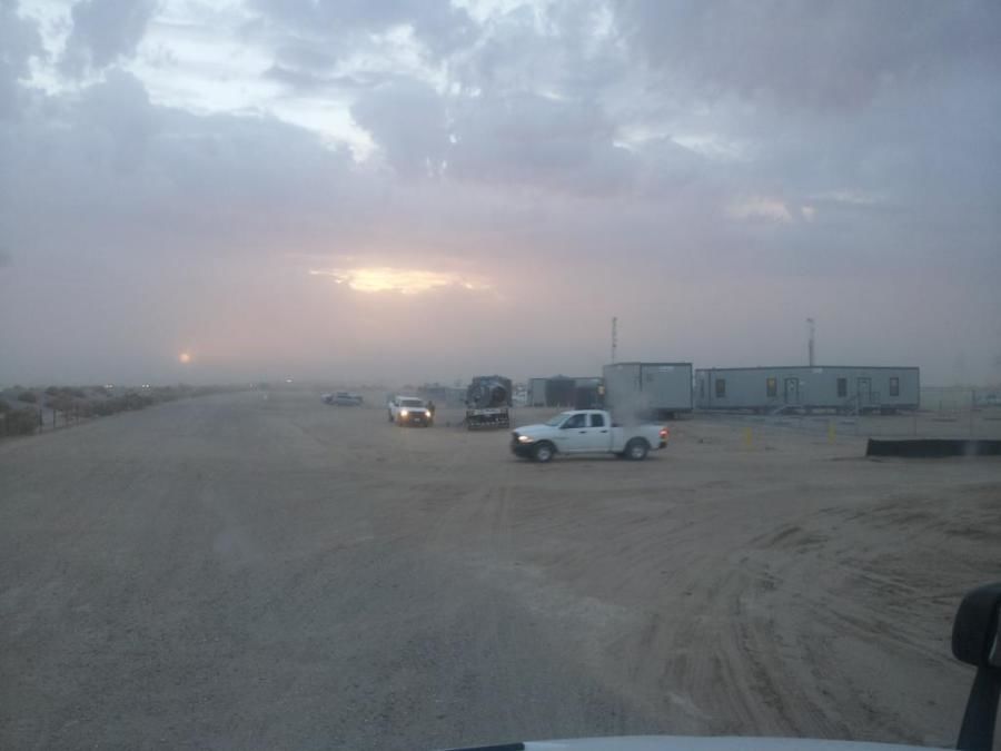 truck drivers delivering in sandstorm in California desert