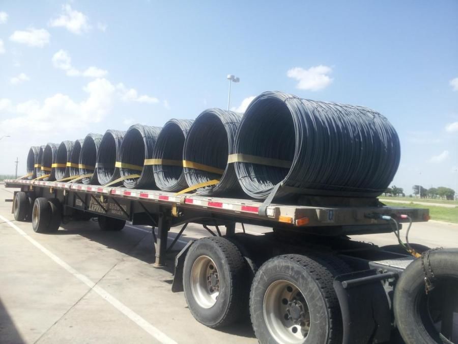 flatbed trailer loaded with steel slinky coils in Colorado City