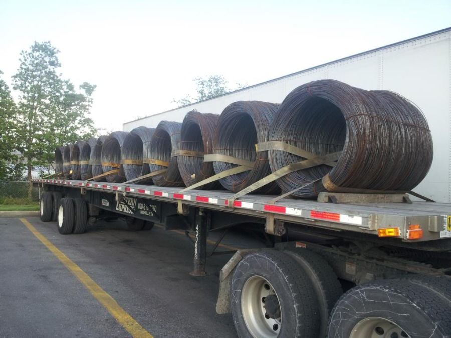 flatbed trailer loaded with metal slinky coils in Breaux Bridge Louisiana