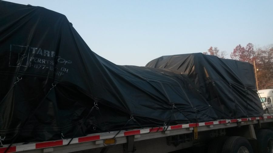 multi-stop Knight flatbed trailer load tarped in the parking lot
