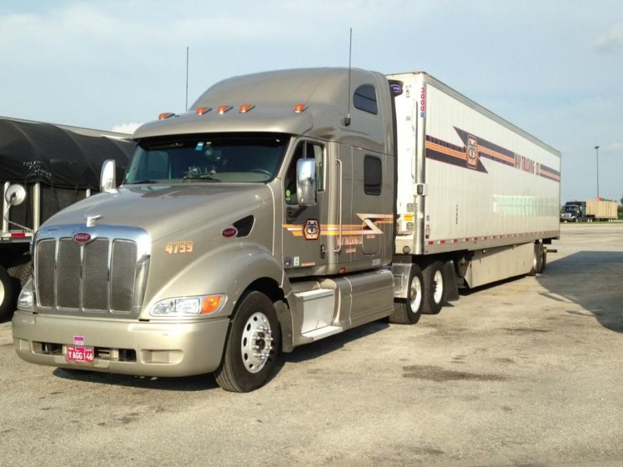 May Trucking gray Peterbilt truck and box trailer