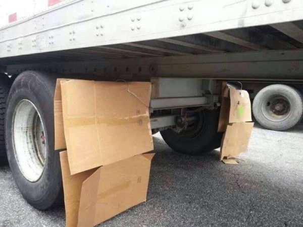 funny trucking picture cardboard boxes used as trailer mudflaps