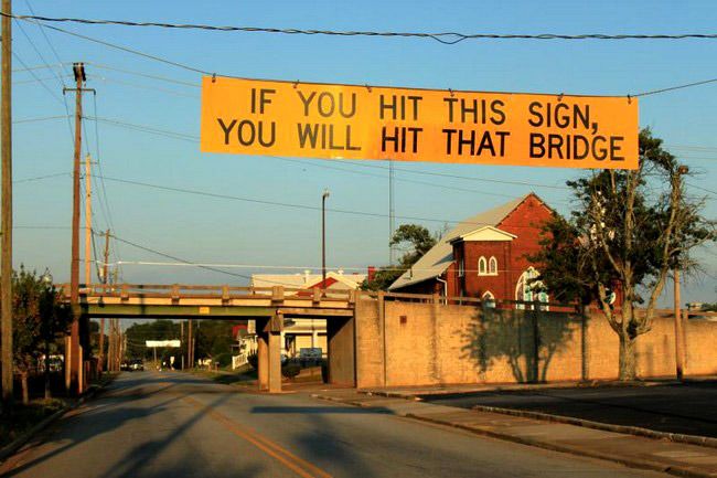 low bridge warning sign if you hit this sign you will hit that bridge