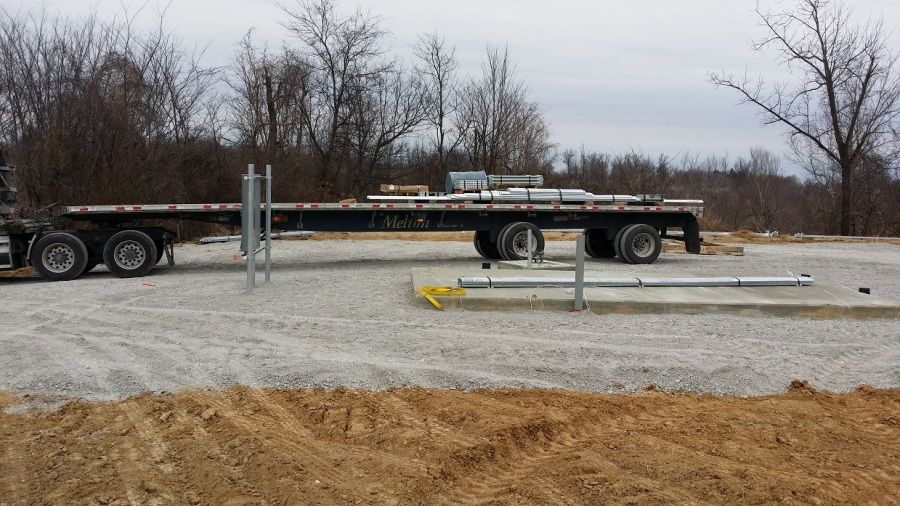pieces of Verizon cell tower loaded on Melton flatbed trailer