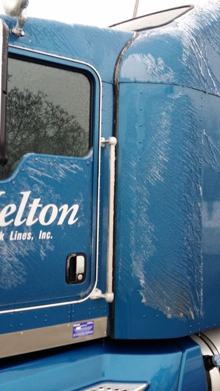 Blue Melton Kenworth flatbed truck cab sleeper iced over from Pennsylvania ice storm