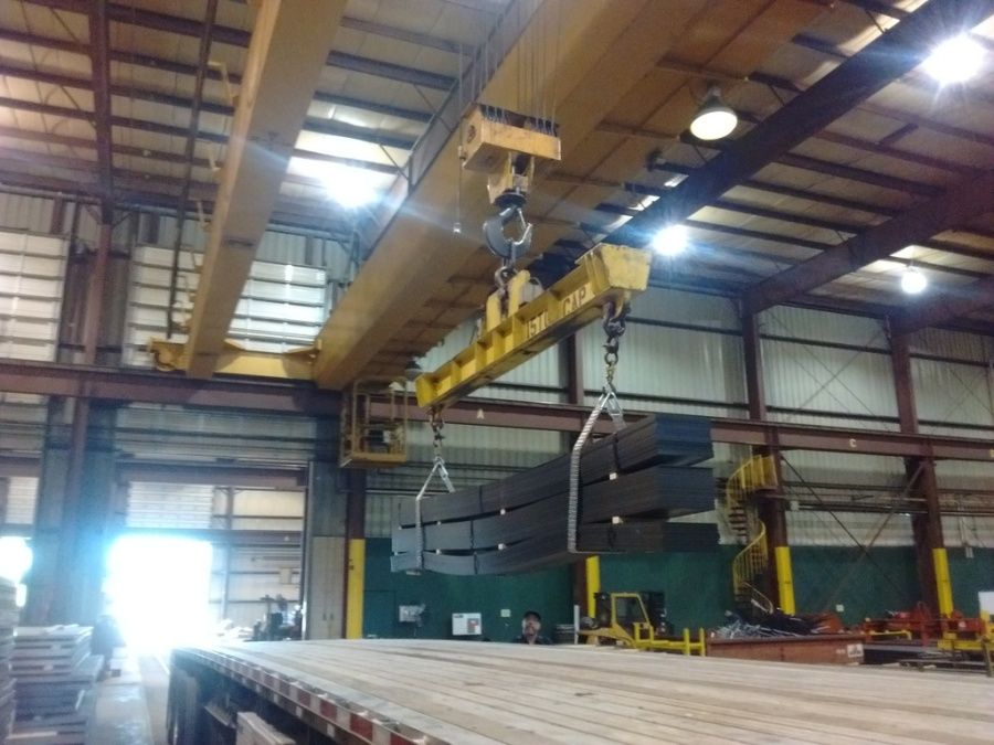 crane at Olympic Steel loading flat steel on to a flatbed trailer