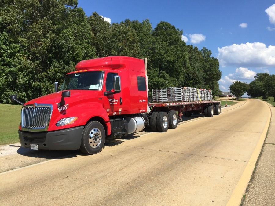 red flatbed top tier driver