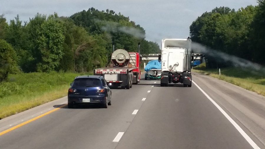 car following trucks too closely on highway