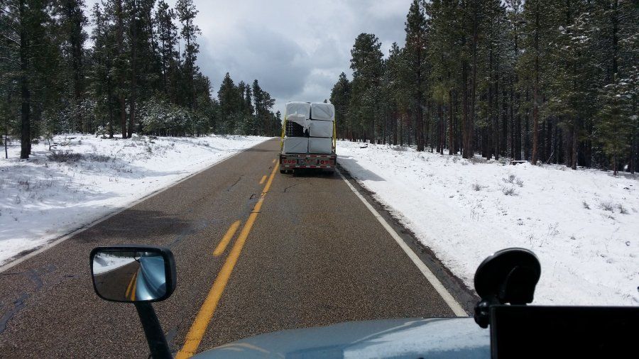 Prime truck going downhill in the snowy mountains