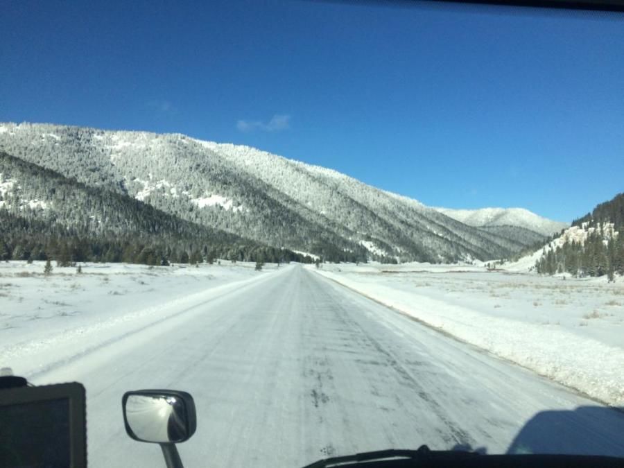 trucker's picture of beautiful snow-covered mountain and road scenery