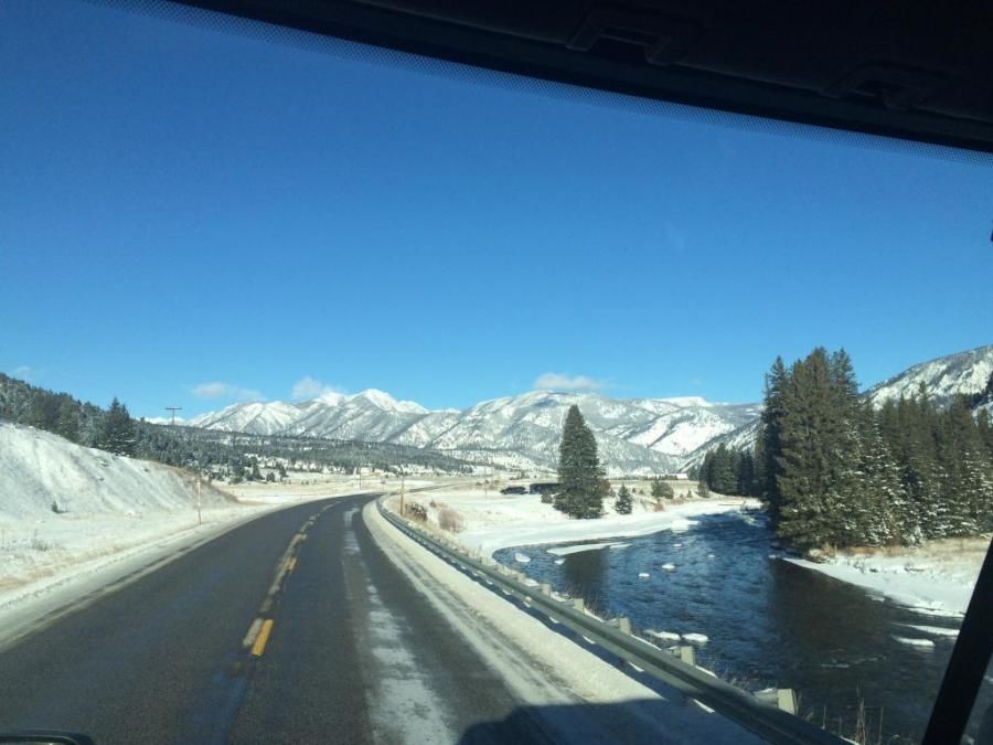 trucker's picture of beautiful snow-covered mountain and road scenery