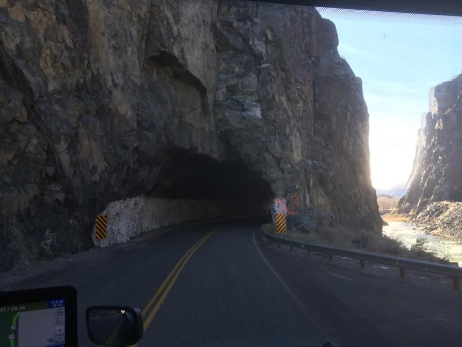 truck driver about to go through a mountain tunnel
