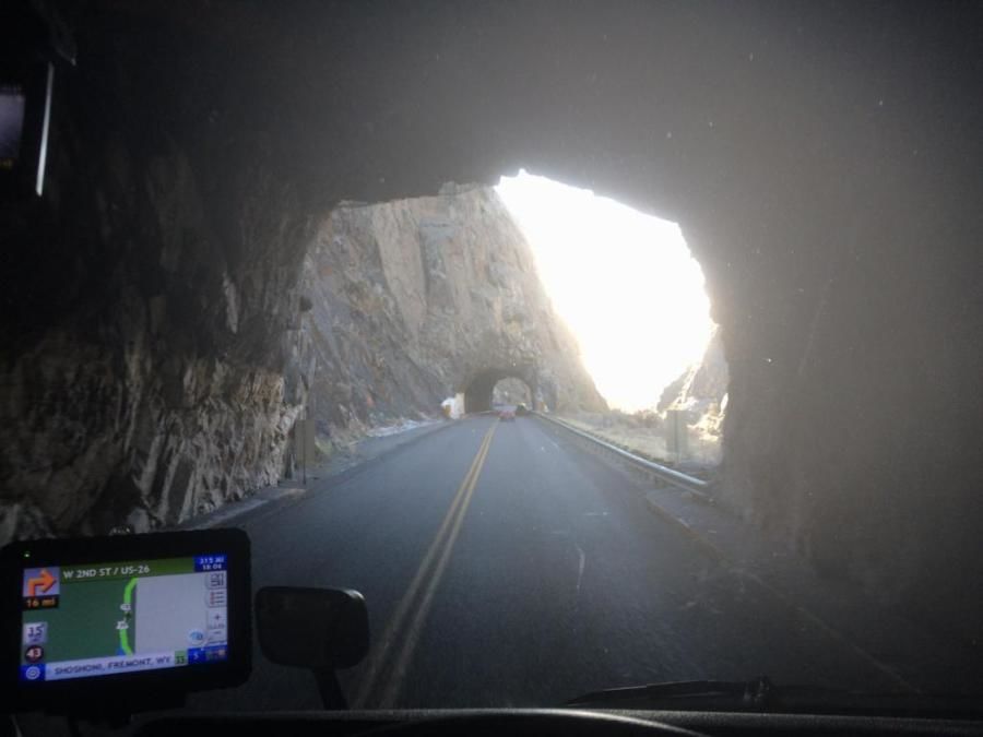 trucker driving through  a mountain tunnel