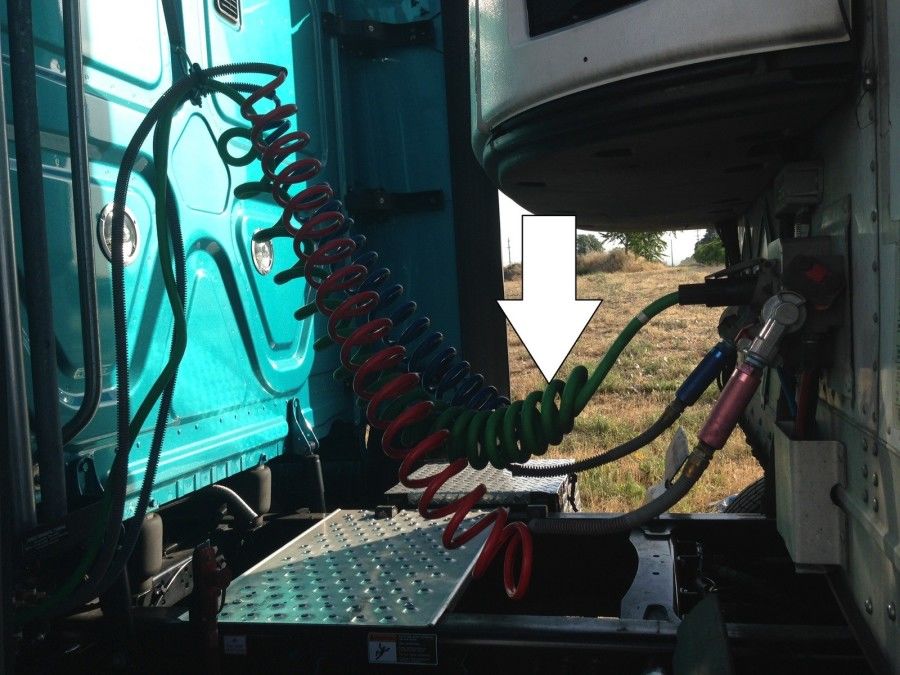 truck driver's pretrip inspection electric lines in coupling area