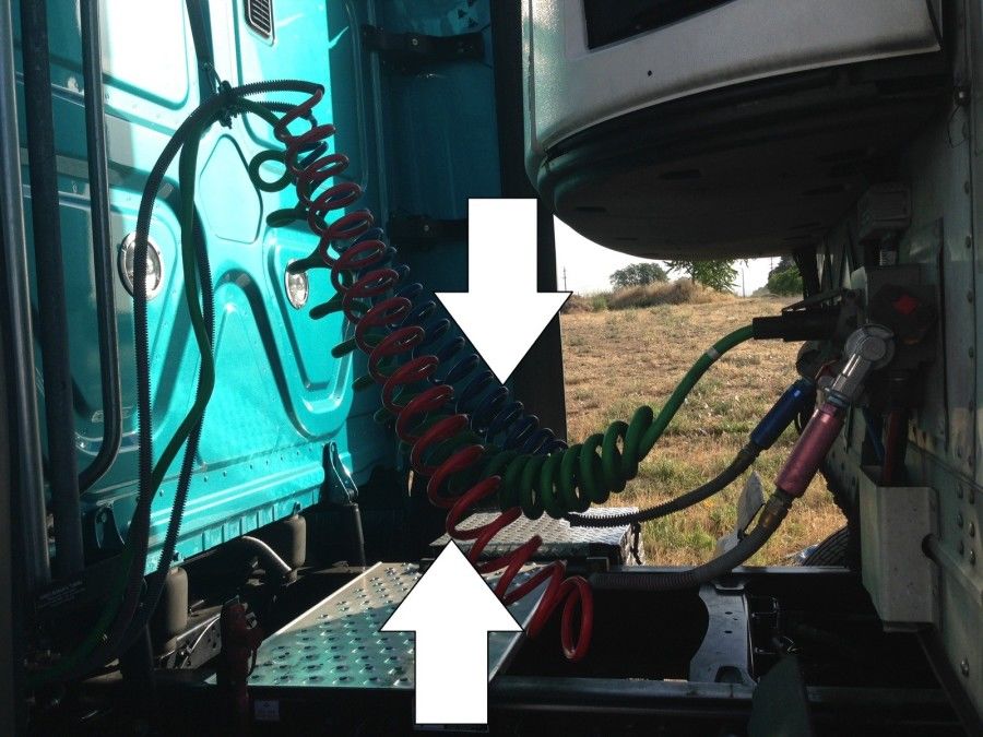 truck driver's pretrip inspection air lines in coupling area