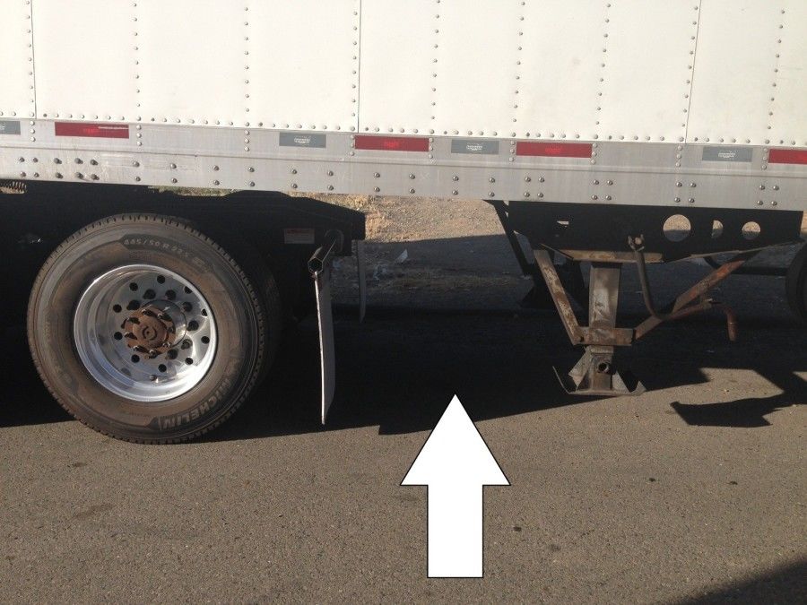 truck driver's pretrip inspection clearance between mudflap and landing gear