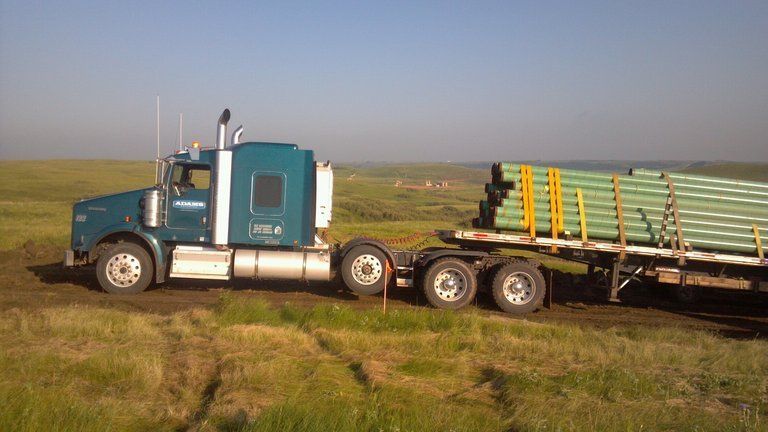 flatbed truck loaded with pipe in North Dakota
