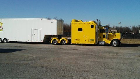 big yellow tractor-trailer semi show condo truck