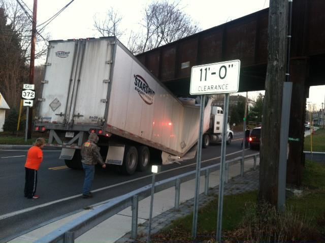 starship tractor trailer stuck under obviously low bridge