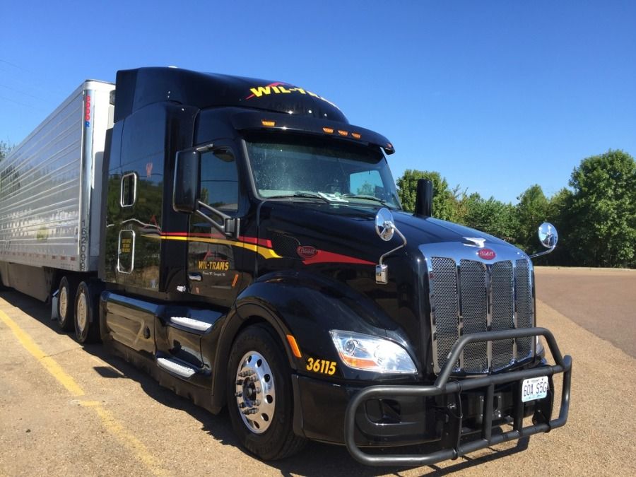 new black Wil-Trans tractor-trailer semi truck