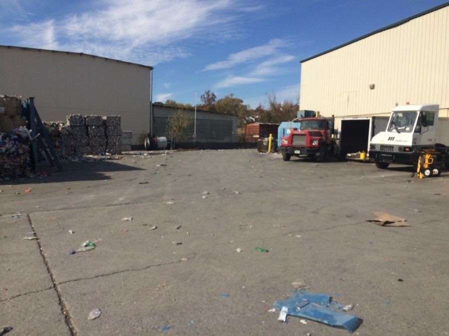 trucker at customer in west rock knoxville tennessee looking at dock with trucks parked