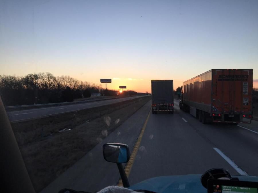 picture of beautiful sunset out of the truckers windshield