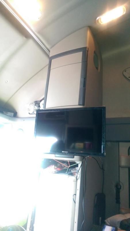 truck driver picture of lcd TV mounted and chained to inside of cab