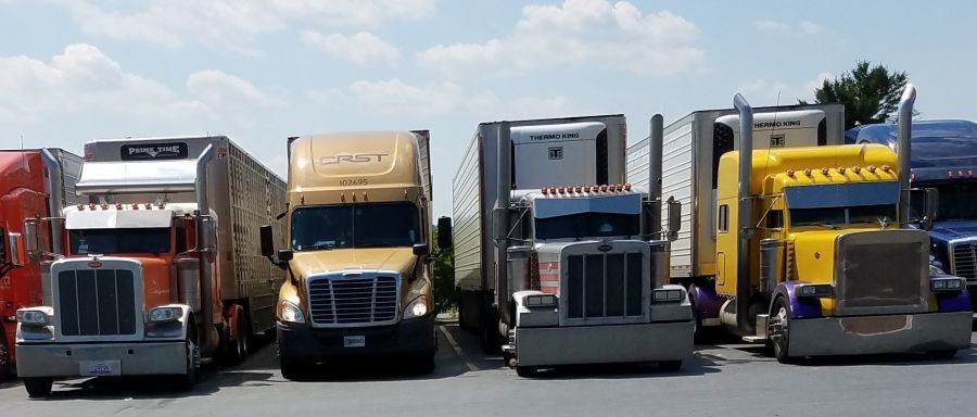 trucks lined up in a truck stop