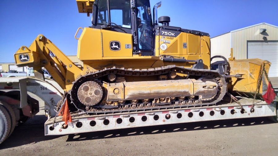 bulldozer on an RGN flatbed trailer