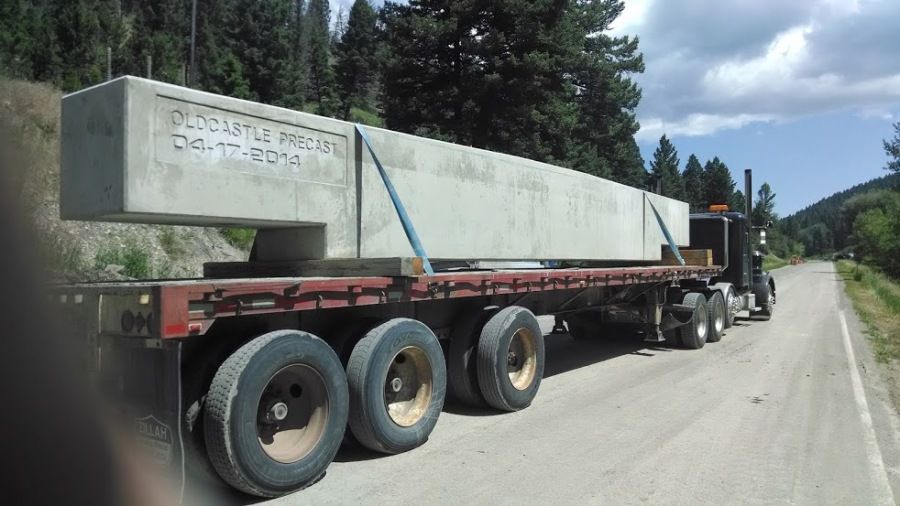 giant cement bridge piece loaded on a flatbed