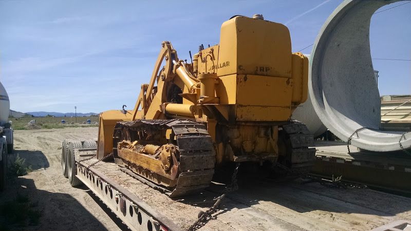large CAT bulldozer loaded on flatbed trailer