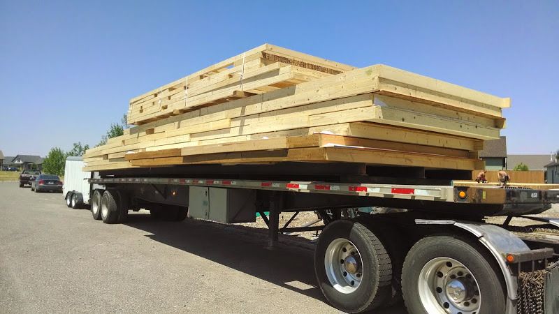 oversized flatbed trailer loaded with construction materials