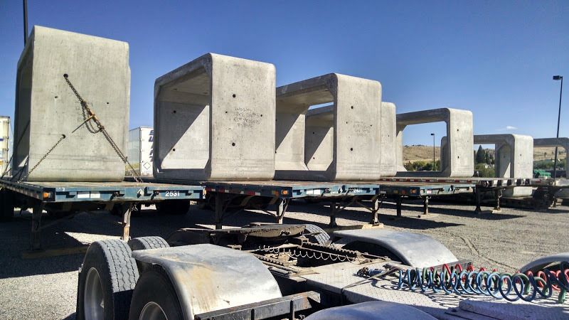 flatbed trailers loaded with cement box culverts