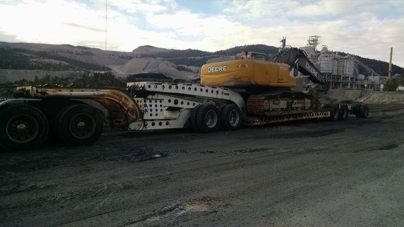 John Deer 350 excavator and metal recycling baler loaded on flatbed trailer