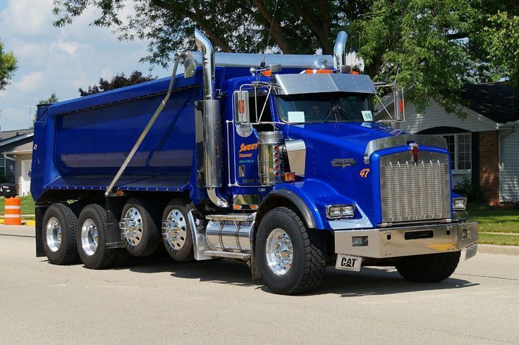 new blue dump truck with two drop-axles