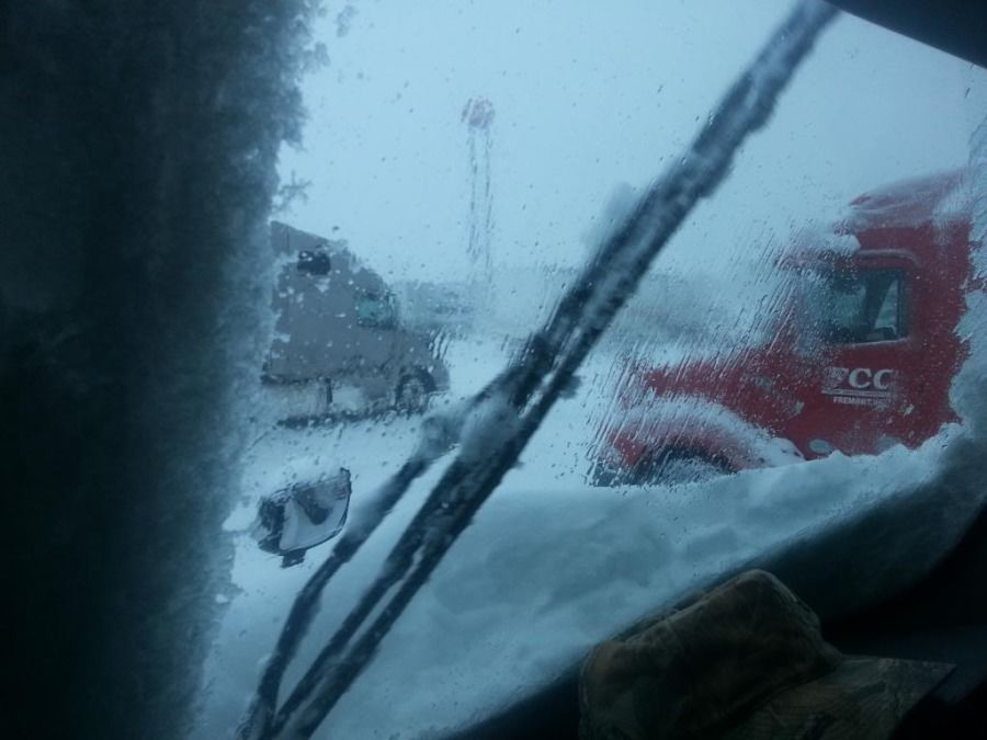 truck drivers view out the window in a snowstorm