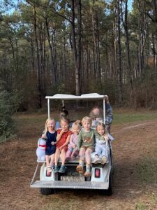 Grandkids on the golf cart.