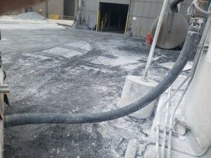 Hose from rear of trailer to silo
